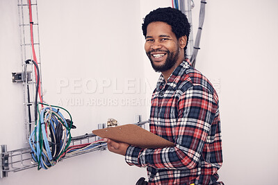 Technician inspecting fiber installation indoors